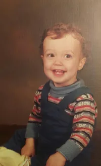 Very young Levi, posed for a photo