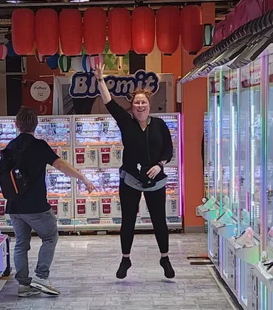 Anna jumping in the arcade