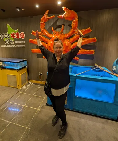 Anna posing with crab sign