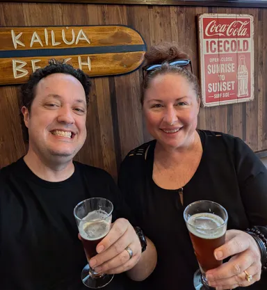 Anna & Levi with drinks at cafe.