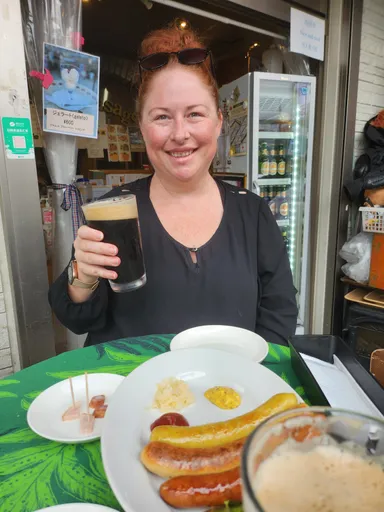 Anna with sausages and beer.