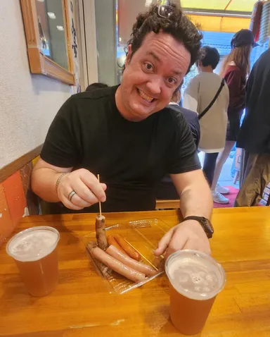 Levi with sausages and beer.