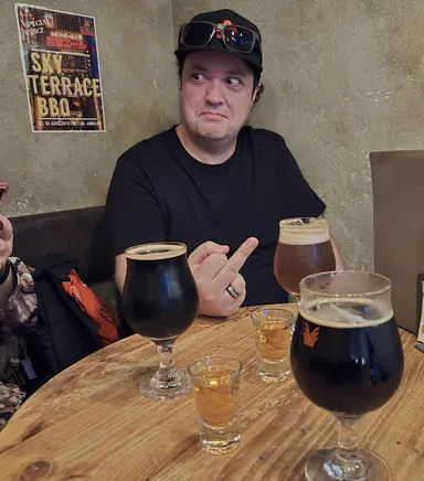 Levi Shinjuku Alehouse, local beers and snake shots on the table