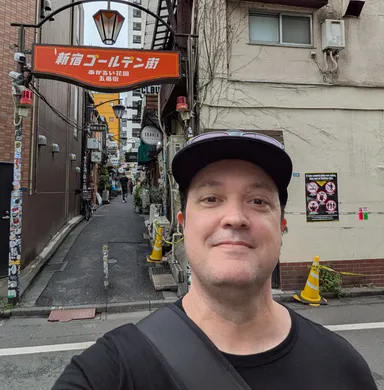 Levi in front of Golden Gai sign