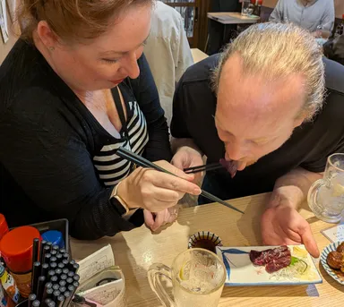 Anna & James trying whale sashimi