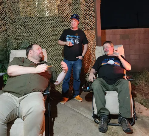 Potter, Levi, & Tierney smoking Cuban cigars on the patio